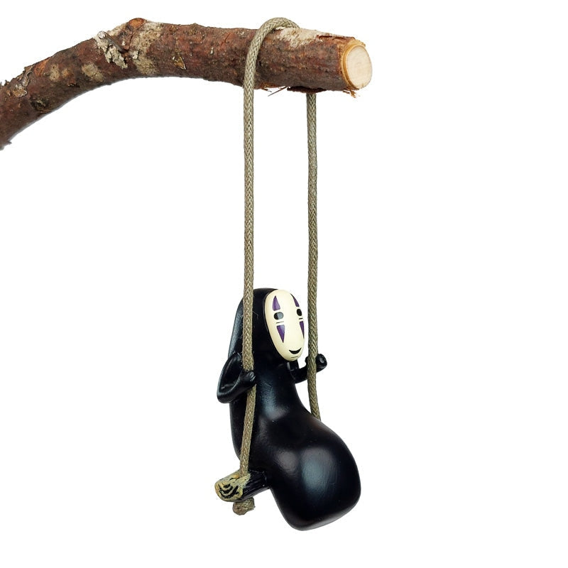 Figurine Sans Visage sur Balançoire